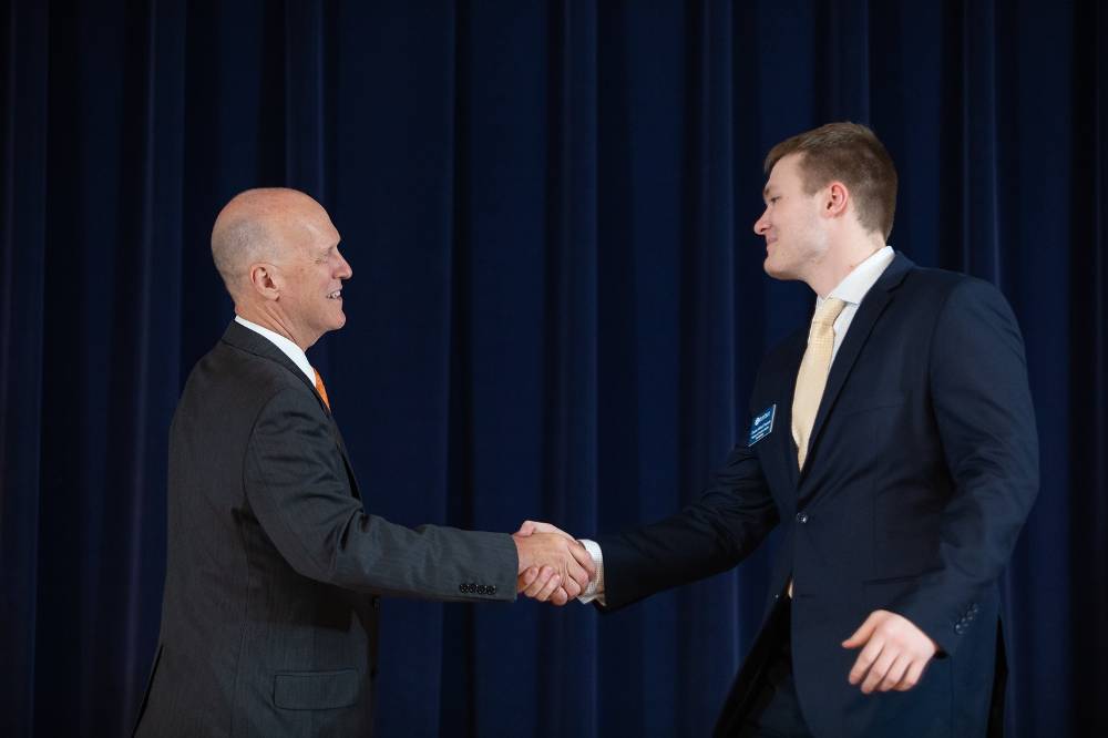 Charles Przybylo shaking hands with Dr. Potteiger